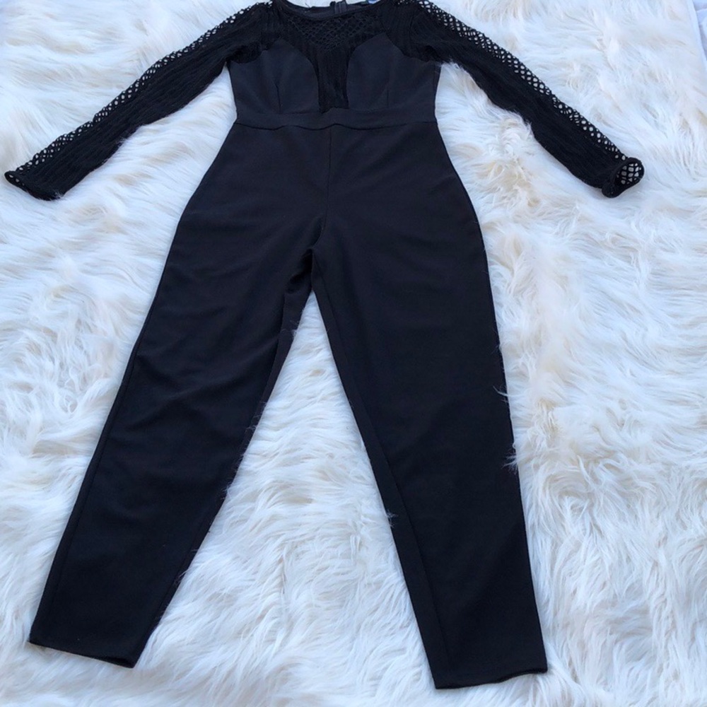 NEW!! JUMPSUIT WITH FISHNET SLEEVES. Never worn!!